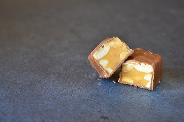 chocolate with nuts on a black background 