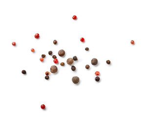 Mix of black and red pepper, pimento isolated on white background. Top view of allspices and spices.