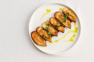 Baked mussels with cheese garlic and herbs in shells