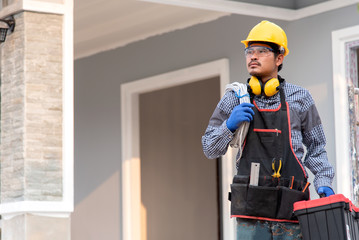  Electrician Fixing the Light Inside Remodeled Apartment. Construction Theme Caucasian Electrician in Yellow Safety Hard Hat at Work. Reinstallation of Residential Electrical System.