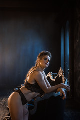 Obraz na płótnie Canvas Fitness strength training workout - muscular bodybuilder sexy sport girl in underwear in a luxury interior