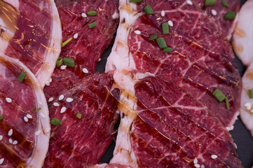 Row of variety beaf sliced in plate.Fresh meat for cooking barbecue.