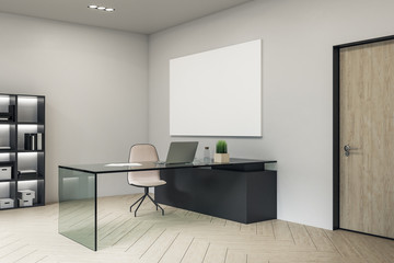 Contemporary director's office with blank poster on wall.