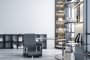 Modern boardroom with laptop and equipment on table.