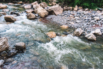 A picturesque wide angle view of the speedy mountain river Roudoule in the low Alps in the evening (Puget-Theniers, Alpes-Maritimes, Provence, France)