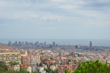 Fototapeta na wymiar City View from park Guell with barcelona city skyline. Barcelona, the cosmopolitan capital of Spain’s Catalonia region, is known for its art and architecture. 