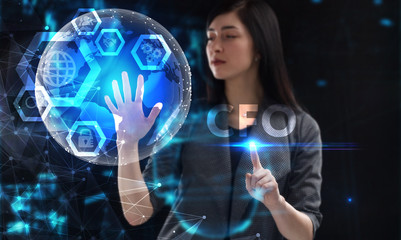 Business, Technology, Internet and network concept. Young businessman working on a virtual screen of the future and sees the inscription: CFO