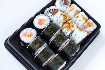 Sushi maki and crispy rolls on the plate