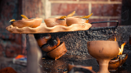 A close up of candle clay holder