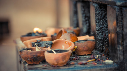 A close up of candle clay holders