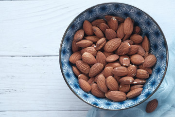 Top view of almond nuts on table with copy space 