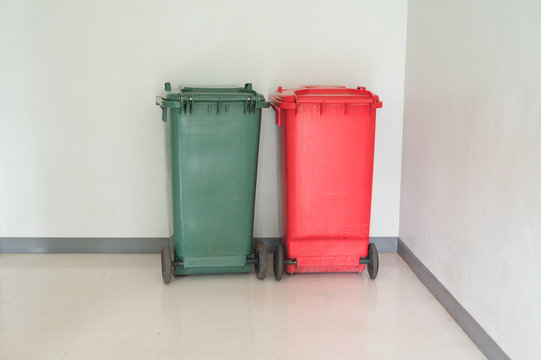 Green and red garbage bin in the hospital.Infection and general trash in the dental clinic.Infectious control concept.
