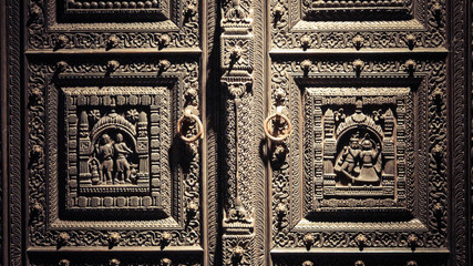 A door with engraved sculpture on it