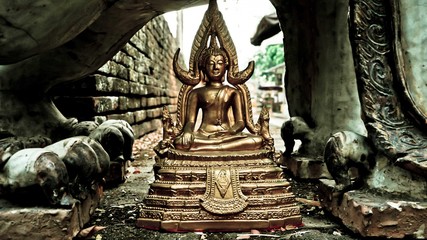 A sculpture of a person with engraved base