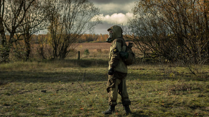 stalker with soviet gas mask in radioactive zone