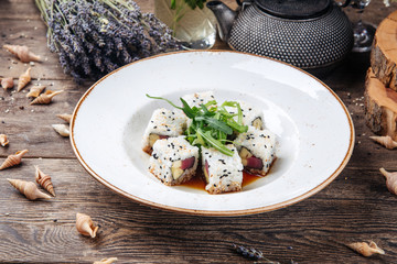Tuna sushi rolls rice sesame seeds and soy sauce