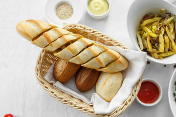 home made bread in basket with white backgroung. top view