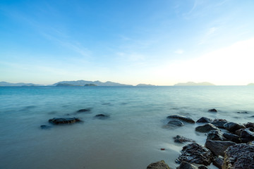 The morning indigo ocean and smooth wave surface. There are many rocks in the sea, many islands...