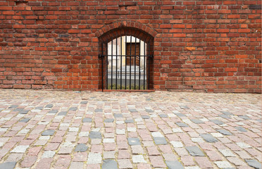 Wall of an ancient castle with paths and handrails