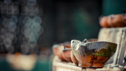 Close up of a candle cup on stone