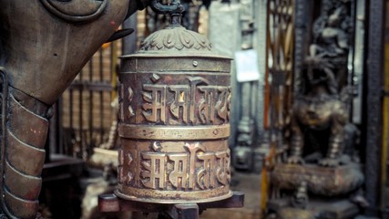 Close up of a bell with written words