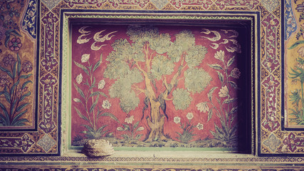 Close up of engraved wall and painting