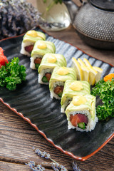 Appetizing tuna and avocado slices sushi rolls
