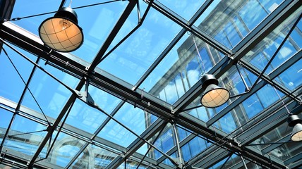 Glass ceiling with lamps in revitalized building.