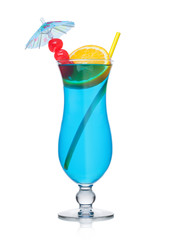 Blue lagoon cocktail classic glass with straw and orange slice with sweet cherry and umbrella on white.