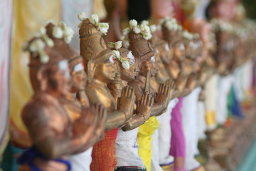 Obraz premium Copper dolls wearing a colourful silk on