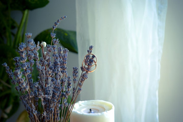 still life with lavender flowers and rings