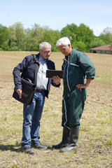 Farmer meeting with financial counseller in farm