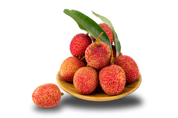 Pile of lychees in a wooden plate on white background with clipping path.