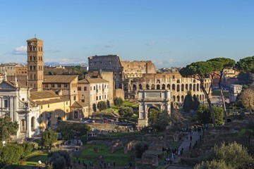 Obraz na płótnie Canvas Ruins of Roman forum with Colosseum on background , Rome, Italy