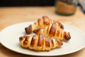 rustic crispy homemade croissants on a plate