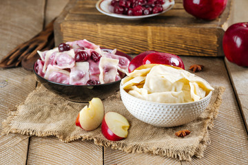 Boiled dumplings vareniki with cherries and apples