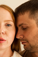 Husband and wife are close to each other. Faces. Close up