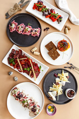 Fish and meat meals variety flat lay. Top view on buffet with assortment of healthy hearty food. Buffet, banquet, appetizer, restaurant menu concept