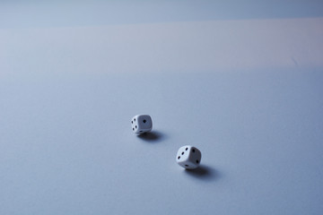 Two dice in motion, on white background,