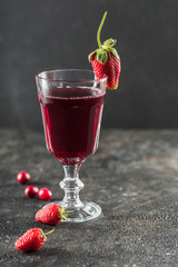 The concept of a summer refreshing drink from red berries: berry Morse of fresh strawberries and...