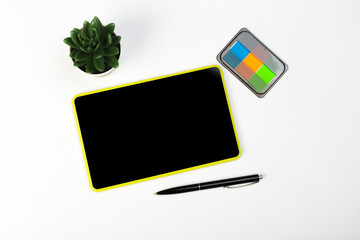 Digital Tablet mockup and stationery on a white table. Flat lay.