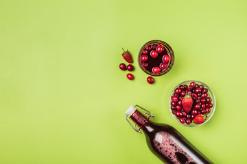 The concept of a summer refreshing drink from red berries: berry Morse of fresh strawberries and...