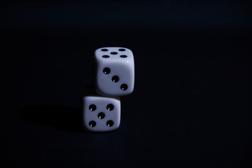 Two dice on black background