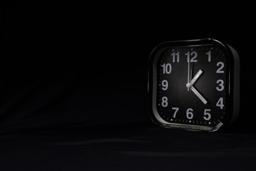 Alarm clock on a dark background