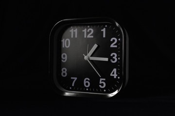 Alarm clock on a dark background