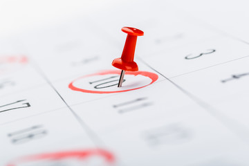 2020 calendar page marked with an important date in red pin. timeline, time, concept, idea,...