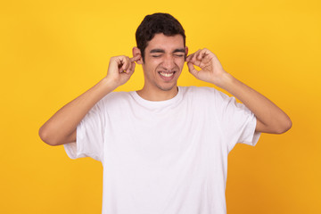 Fototapeta premium young male teenager isolated on white background wearing shirt