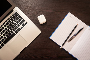 Notebook, pen, pencil and notebook on the table. Remote work.