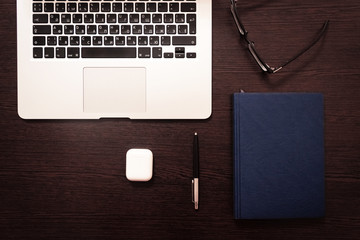 Notebook, pen, pencil and notebook on the table. Remote work.