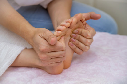 Close-up of children's foot massage on the sofa.